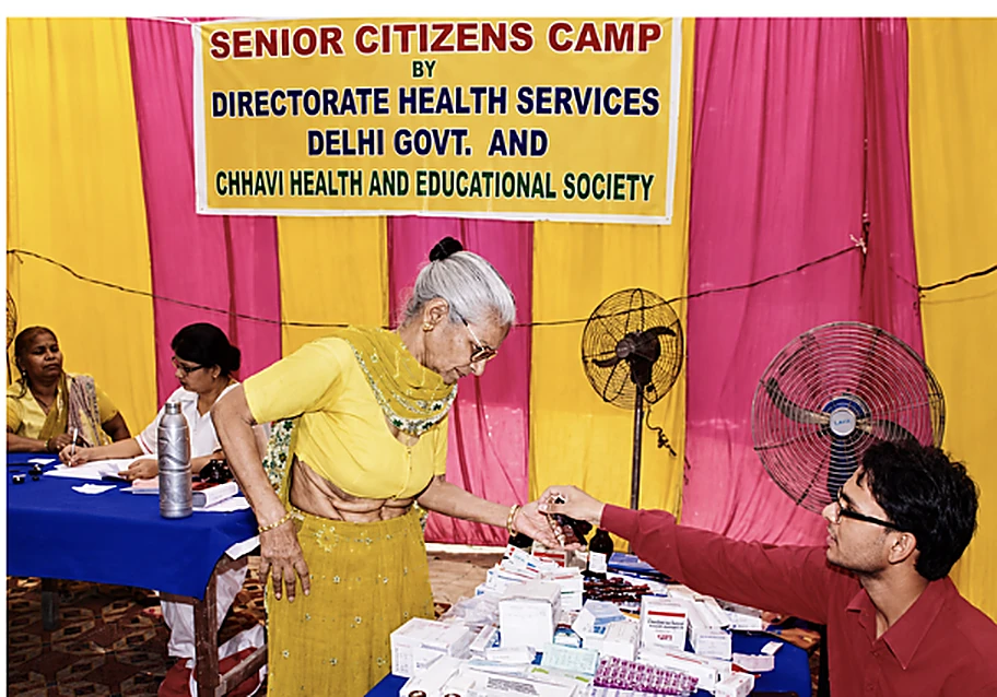 CHES staff dispensing medicines at a senior citizens health camp run with the Directorate of Health Services, Delhi Government