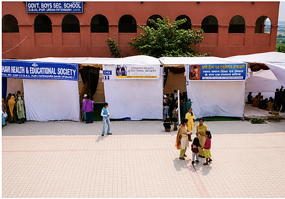CHES camp tents set up in the courtyard of a government boys' secondary school
